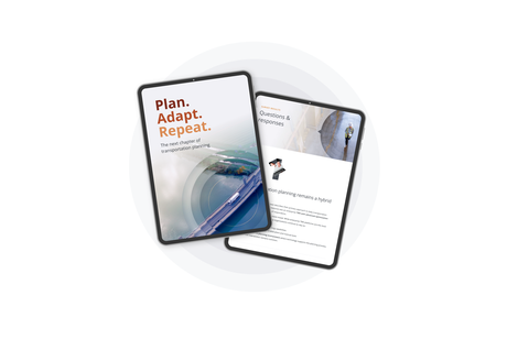 Two digital reports on tablets showing transportation planning insights and surv